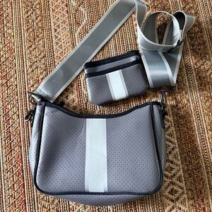 HAUTE SHORE Black Crossbody with Pink and Orange Logo Accents